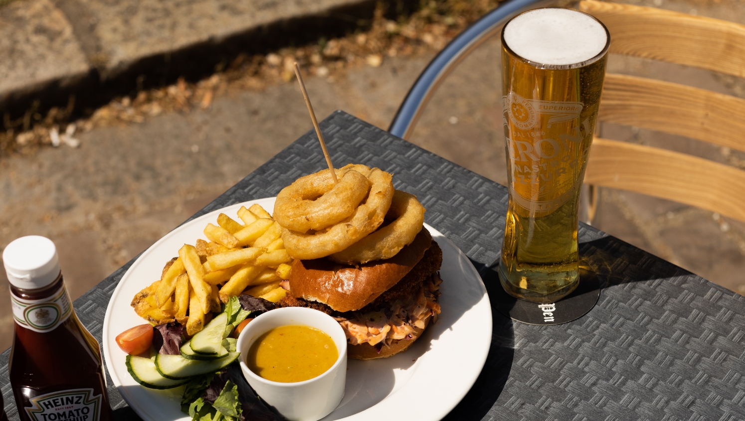 burger and pint outside pub